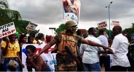 A Malian soldier manages a crowd of junta supporters. Credit: Michele Cattani/AFP via Getty