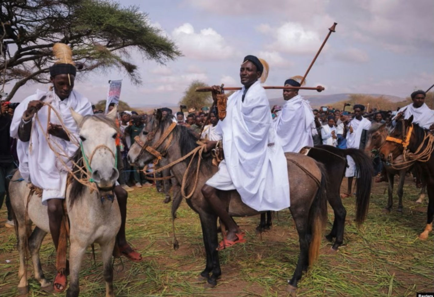 Figure 5. Borana leaders and community members in traditional attire carrying ceremonial whips during the celebration marking the election of Guyo Boru Guyo as the 72nd Abba Gadaa of the Borana (right). Photograph by Reuters, published by Voice of America, March 2025.