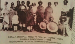 Figure 1. Borana Immigrants at Ellis Island. Photograph by Augustus F. Sherman, ca. 1905–1920. U.S. National Archives, Ellis Island 2005 Exhibition (New York, 2005). Photograph of the book page by Sora Halake from a copy held at the Martin Luther King Jr. Memorial Library, Washington, D.C.