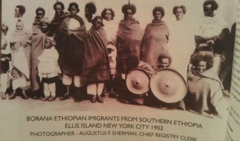 Figure 1. Borana Immigrants at Ellis Island. Photograph by Augustus F. Sherman, ca. 1905–1920. U.S. National Archives, Ellis Island 2005 Exhibition (New York, 2005). Photograph of the book page by Sora Halake from a copy held at the Martin Luther King Jr. Memorial Library, Washington, D.C.
